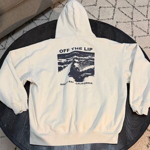 Brandy Melville Off The Lip Cream Hoodie with Navy Graphic